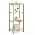 Vasagle 4 tier glass shelving unit in gold, front view with books and storage boxes