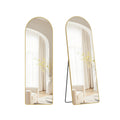 Arched full length floor mirror on its stand, shown face-on and from the side, reflecting a cream armchair and curtains