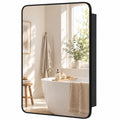 Black-framed rectangular bathroom mirror cabinet with a rounded-corner door, shown closed on a bathroom wall
