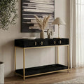 Black hair-on-hide console table with gold metal frame styled in a hallway setting