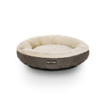 Brown round donut-shaped dog bed with cream plush interior