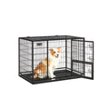 Dog sitting inside the Feandrea heavy-duty metal wire crate with door open