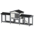 Grey and white rabbit hutch on a plain background with side run boxes and a black asphalt roof