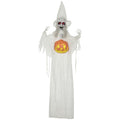 White Halloween witch decoration in a pointed hat holding a glowing carved pumpkin