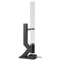 Black wood pellet patio heater with a clear glass tube on a white background