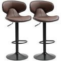 Set of 2 brown faux leather swivel bar stools with curved backs, black steel pedestal bases and footrest rings