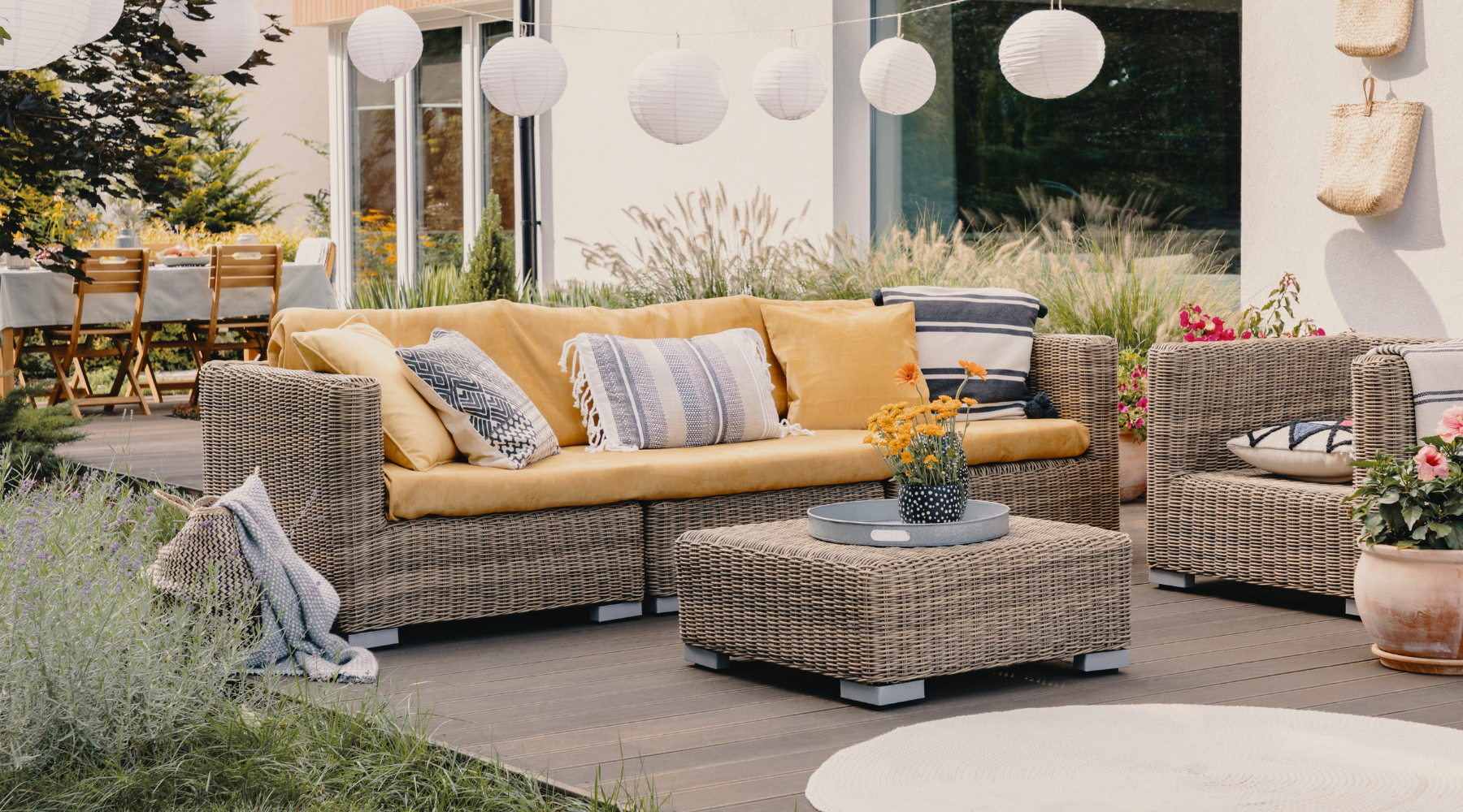 A garden with wicker outdoor patio garden furniture