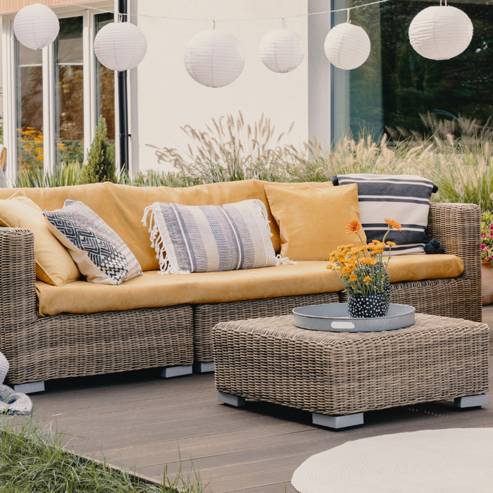 A garden with wicker outdoor patio garden furniture