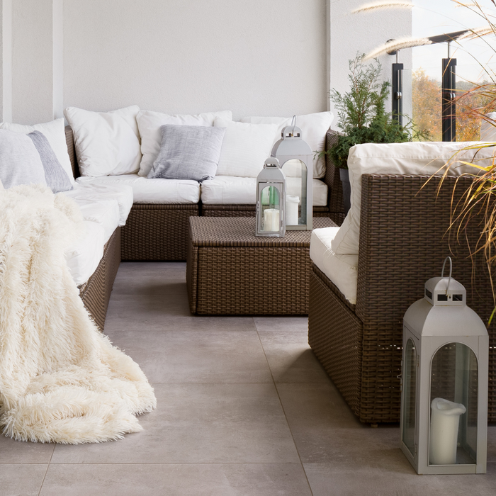 A serene garden scene with wicker rattan garden furniture Cushions and Accessories 