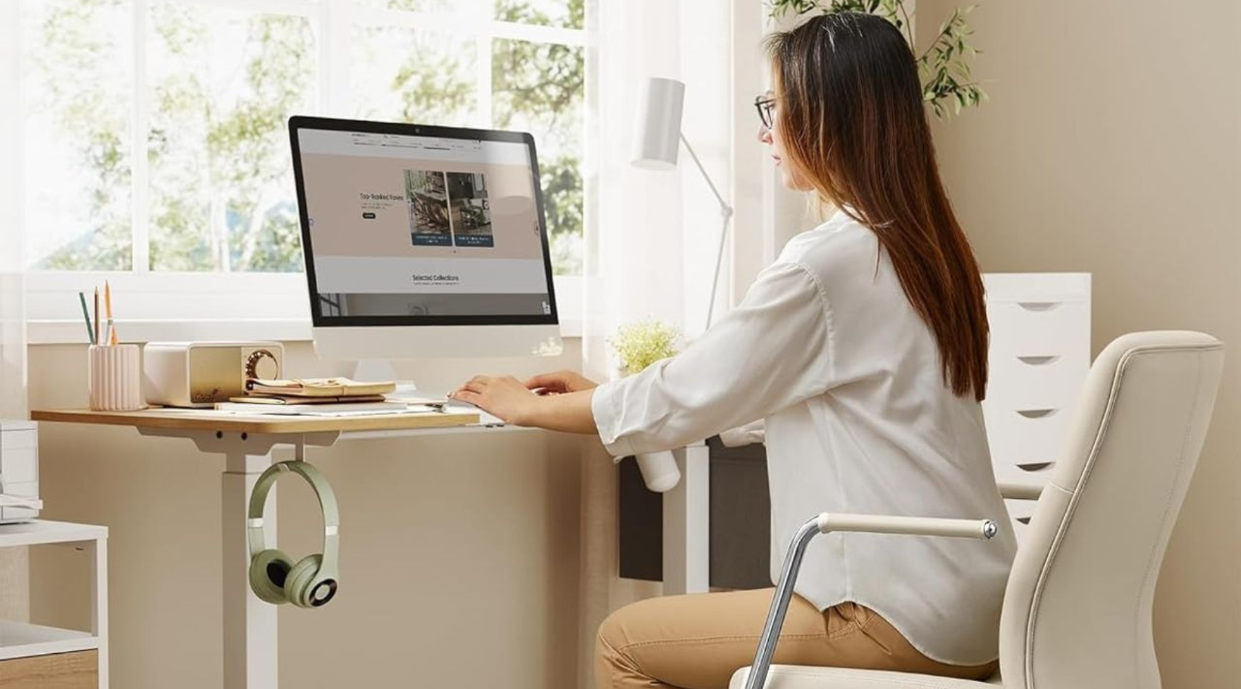 Image of a home office setup with a standing desk and modern office chair