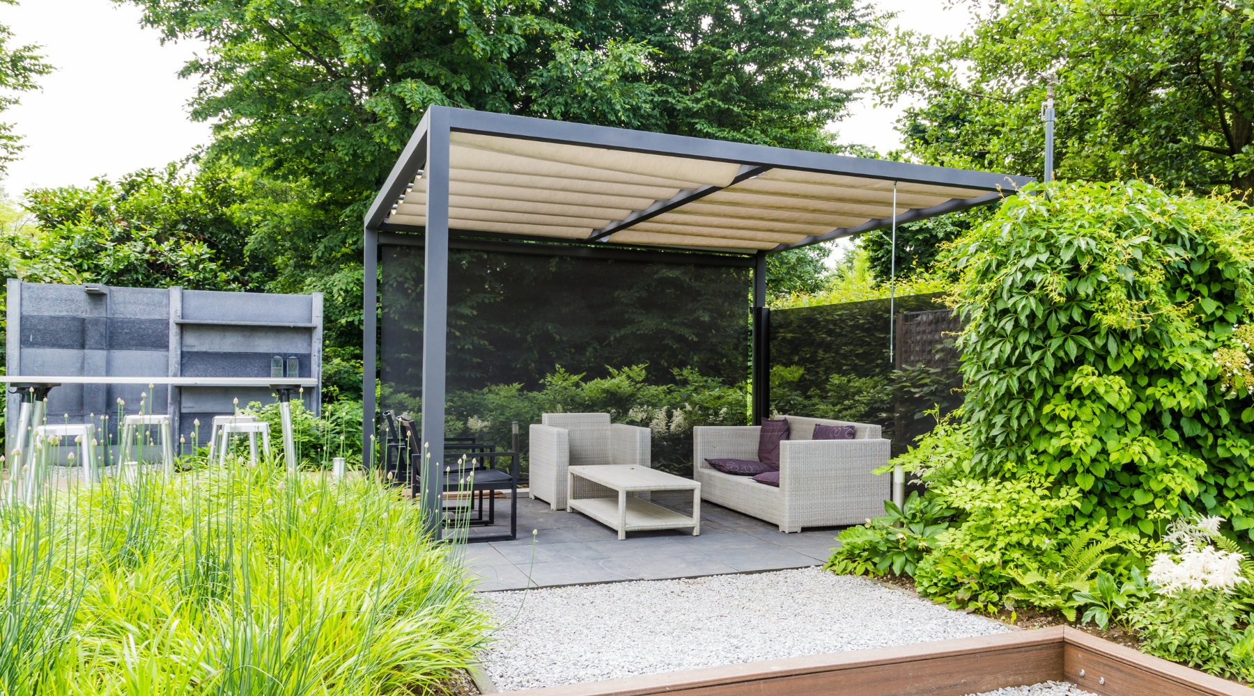Image of a cosy patio scene with a pergola and patio furniture