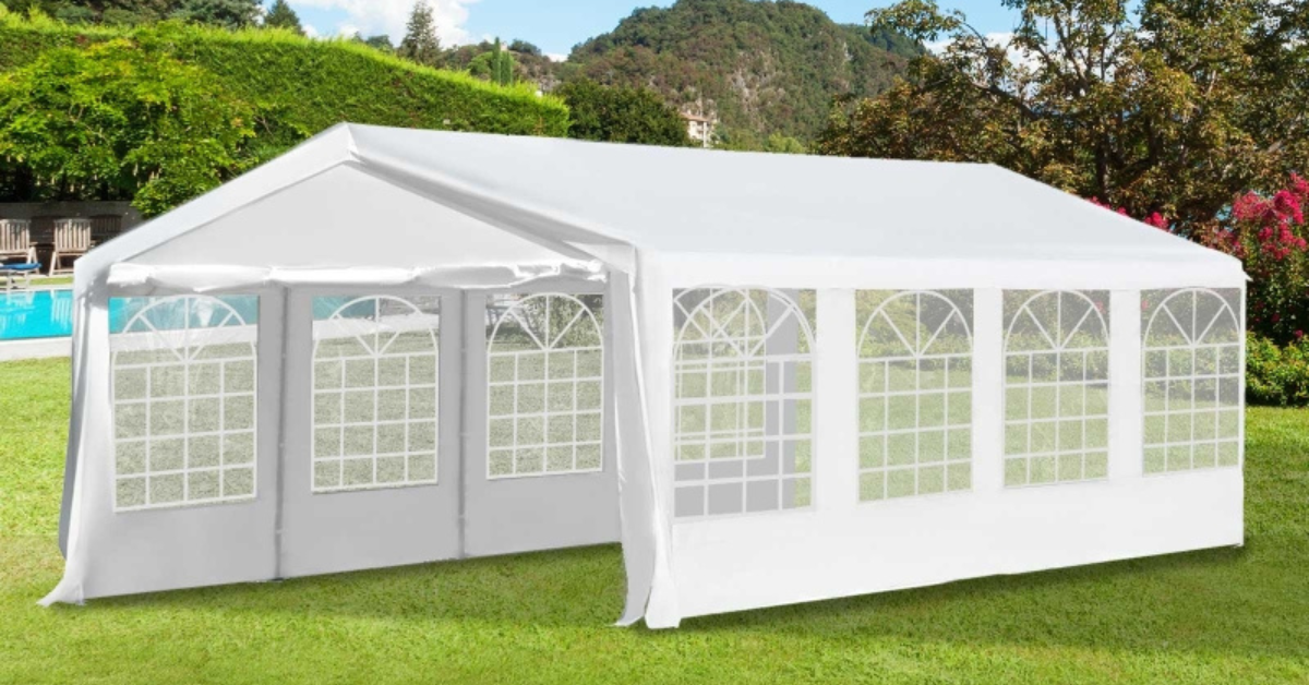 Large white party tent marquee set up in a UK garden for an outdoor event