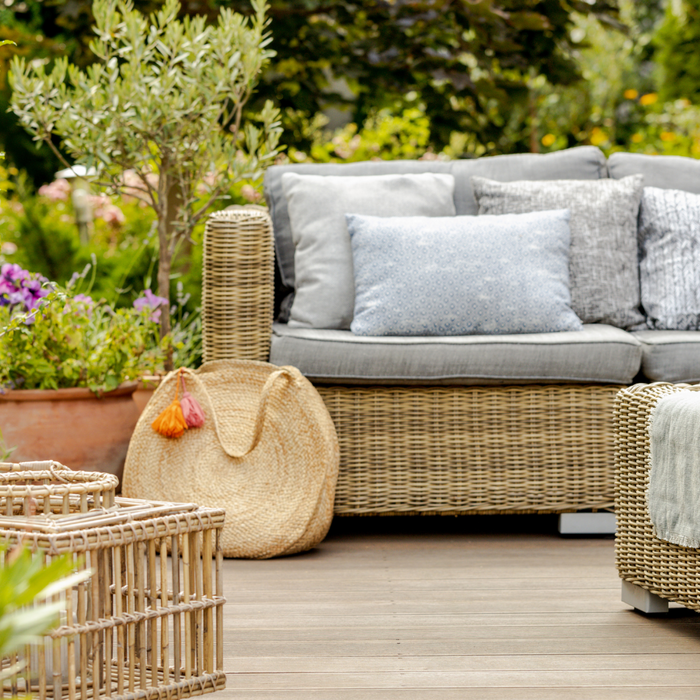 Modern designed terrace with wicker furniture and plants