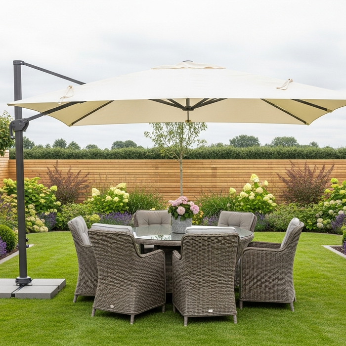 Ivory cantilever garden parasol open over a rattan dining set on a neat British lawn with planting borders