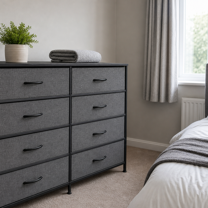 A grey fabric-drawer chest of drawers styled in a bright, tidy UK bedroom