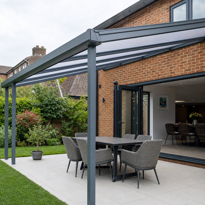 Wall mounted lean-to pergola with polycarbonate roof attached to a house wall over a patio