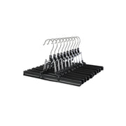 Set of 10 black Songmics clamp bar skirt hangers stacked on a white background