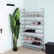 Shoe rack holding several pairs of shoes in a hallway corner