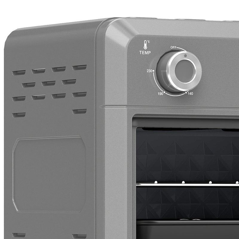 Close-up of the temperature and timer control knobs on the grey air fryer oven