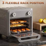 Flexible rack position view of the grey oven with the door open and food on three levels