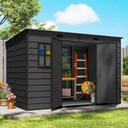 Dark grey garden storage shed with double doors open, showing shelving, a workbench and a ladder inside