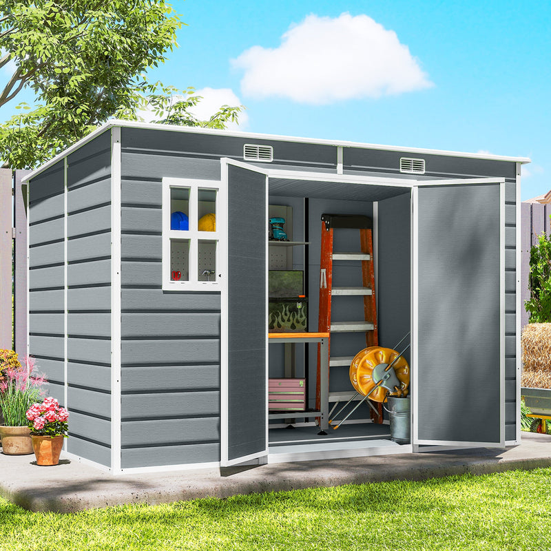 Grey garden storage shed with double doors open, showing shelving, a workbench and a ladder inside
