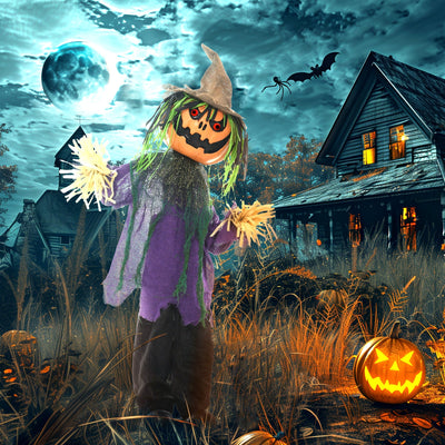 Pumpkin scarecrow animatronic in a haunted house garden scene at night