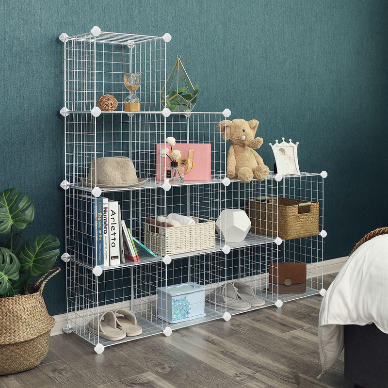 White cube organiser built as a stepped run against a dark green bedroom wall with toys and baskets