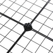 Close-up of a black plastic corner connector joining four wire mesh panels