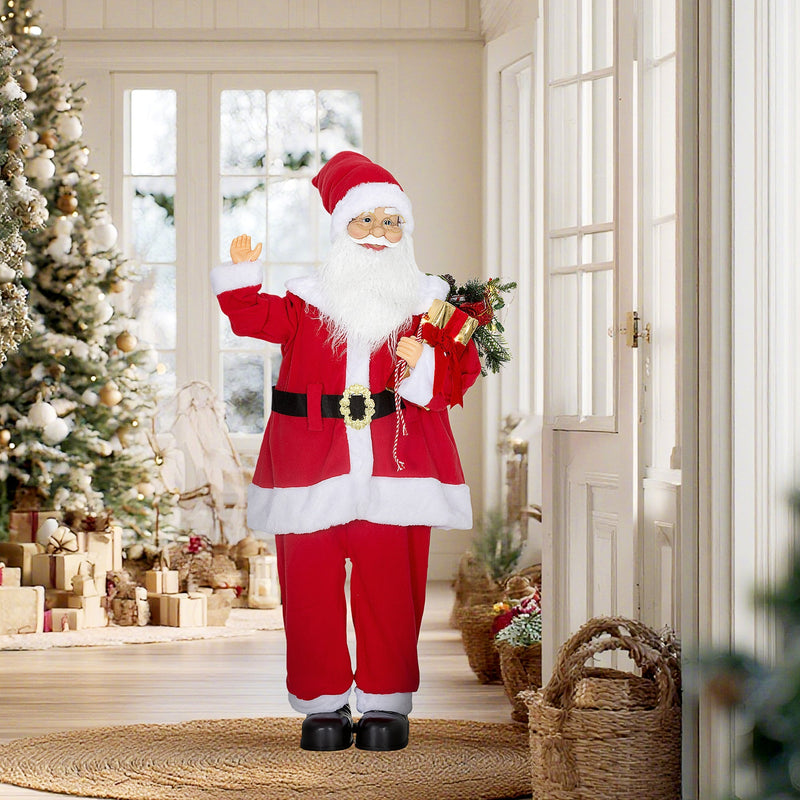 Santa Claus figure in a bright hallway beside a Christmas tree and gifts