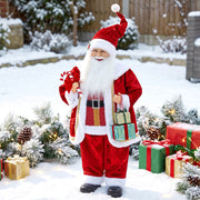 Santa Claus figure outdoors in the snow among wrapped gifts