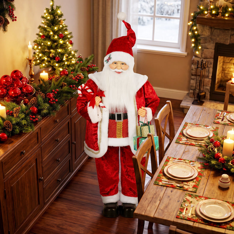 Santa Claus figure beside a dining table set for Christmas