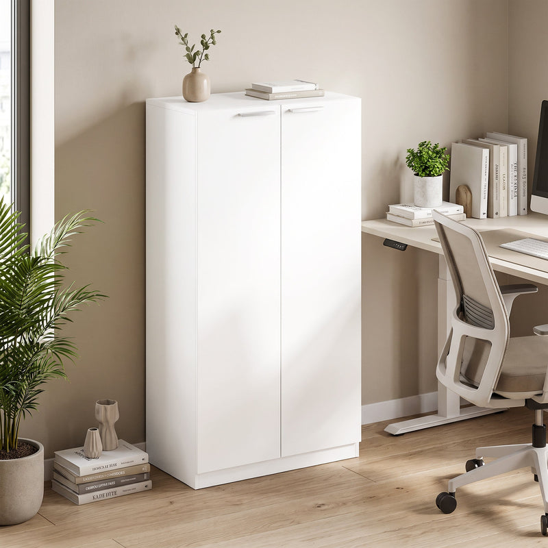 White storage cabinet styled in a home office beside a desk and chair
