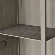 Close-up of a slatted shelf and the centre post inside the grey shed