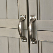 Close-up of the two metal door handles on the grey shed