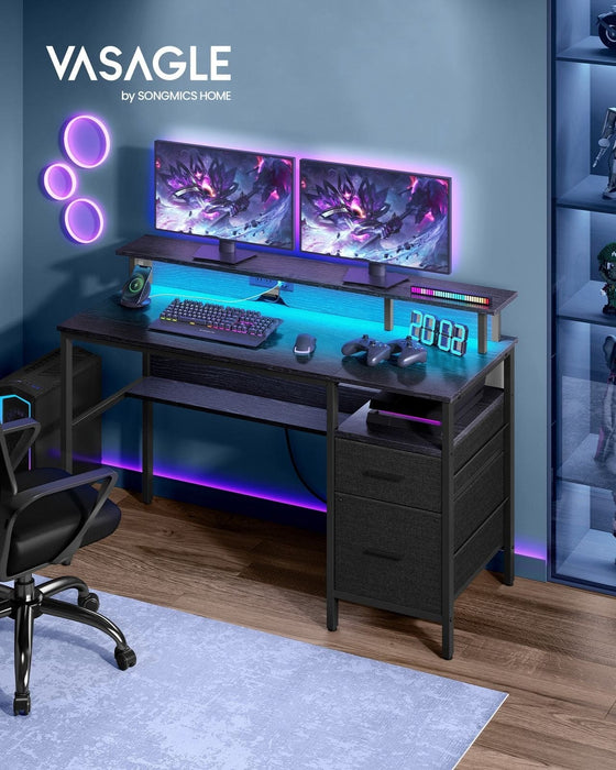 Image of a black Vasagle 135cm gaming desk with drawers and LED lights