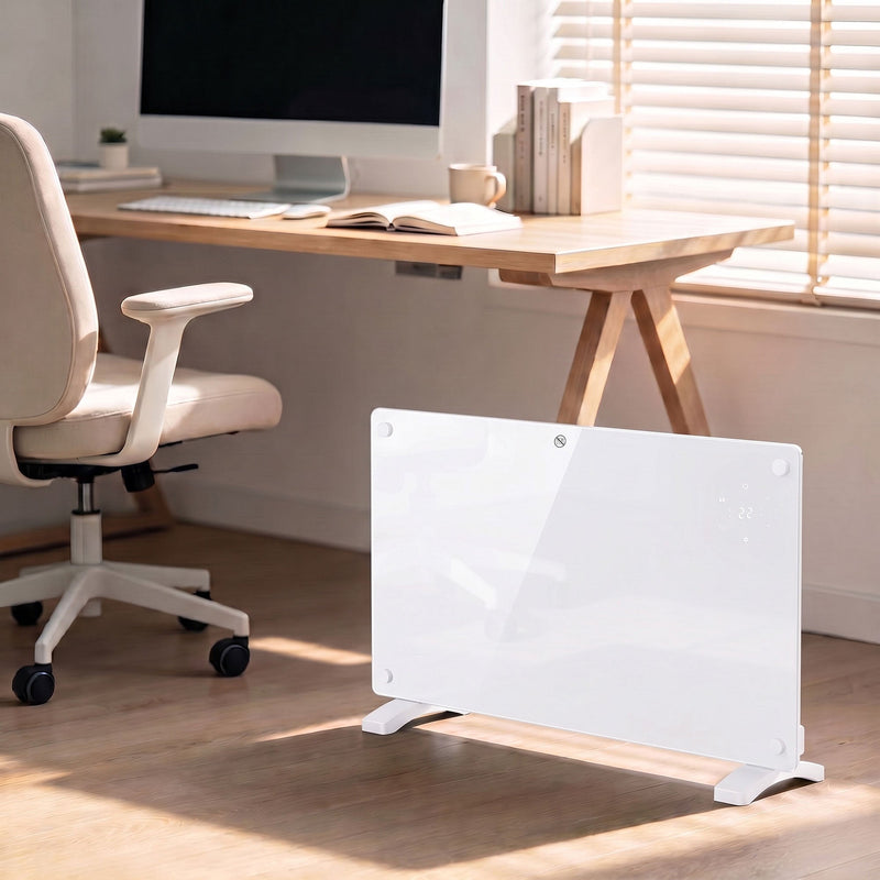 Freestanding white panel heater warming a home office beside a desk