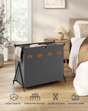 Songmics laundry hamper styled in a bedroom next to a bed