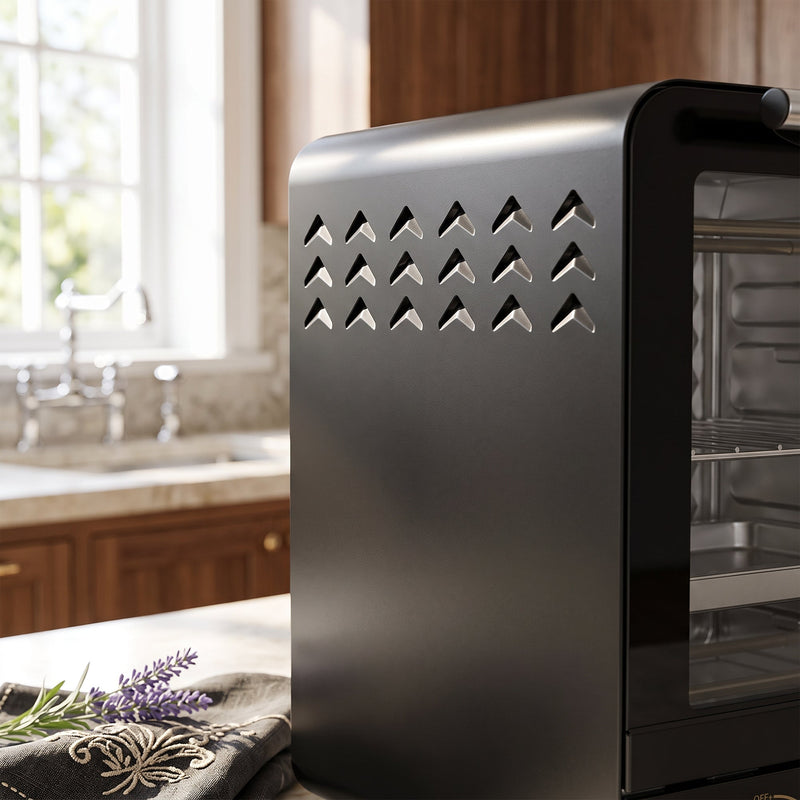 Side view of the black mini oven showing ventilation slots