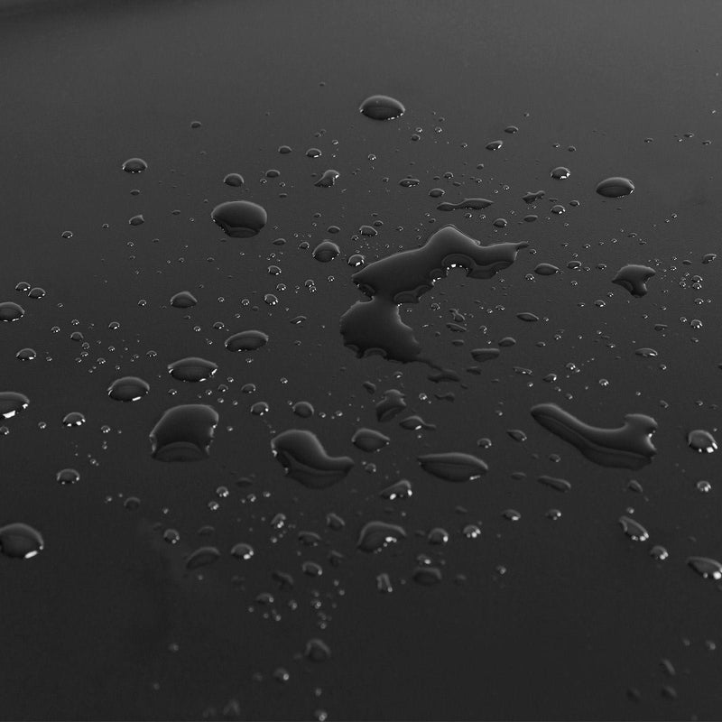 Close-up of water droplets on the smooth black panel surface showing its wipe-clean finish