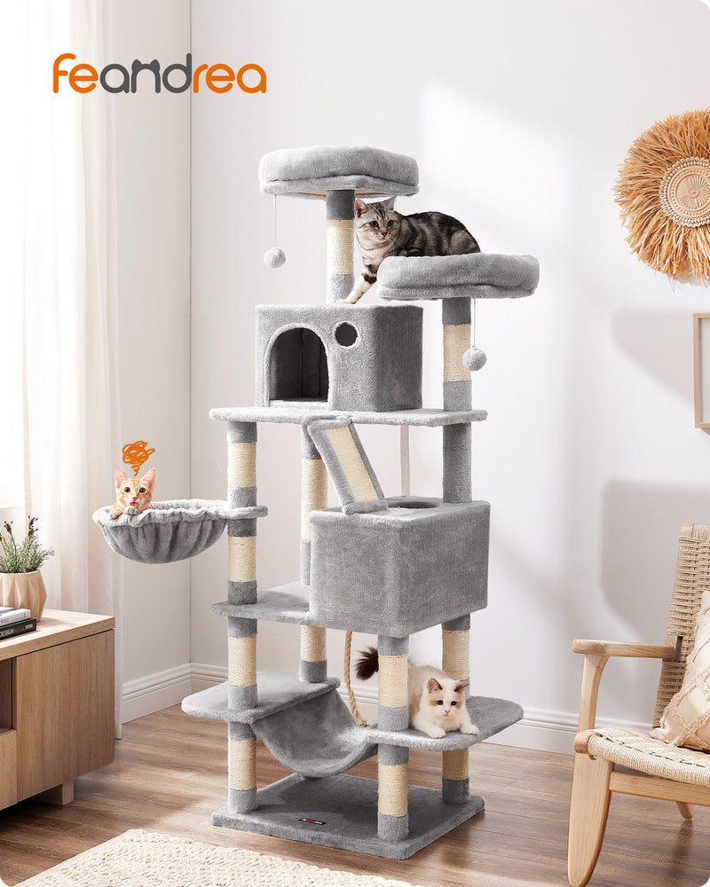 Light grey cat tree in a home setting with cats climbing