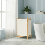 The sorter standing next to a freestanding bath by a bright window