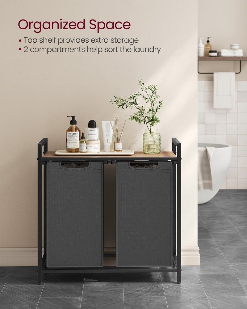 Laundry sorter against a beige bathroom wall with toiletries on the shelf and both grey bags closed
