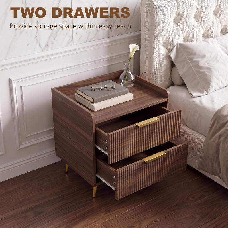 Two drawers open beside a tufted headboard with a vase and books on top