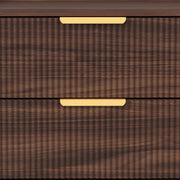 Close-up of the ridged fluted drawer texture and gold-tone pull handle