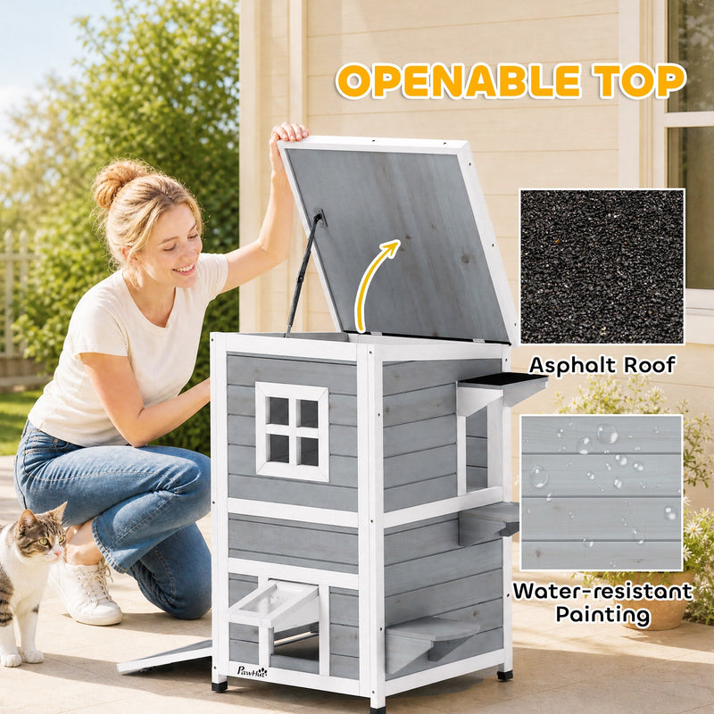 Person lifting the flat roof of the cat house to show the openable top access