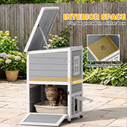 Cat sitting in a litter tray on the bottom floor with the roof open and the removable panel labelled