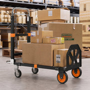Trolley carrying stacked boxes and a large parcel on the platform in a stockroom
