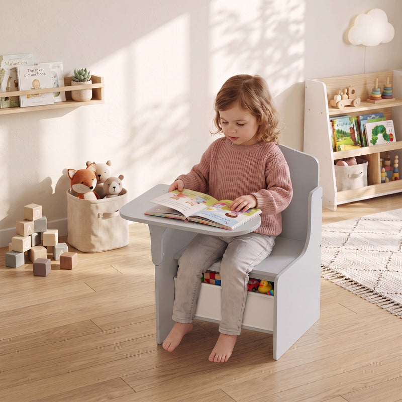 Young girl sitting in the AIYAPLAY desk chair reading a book at the attached tabletop
