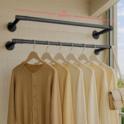 2 pack wall-mounted industrial pipe clothes rails by Songmics, styled in a bedroom setting